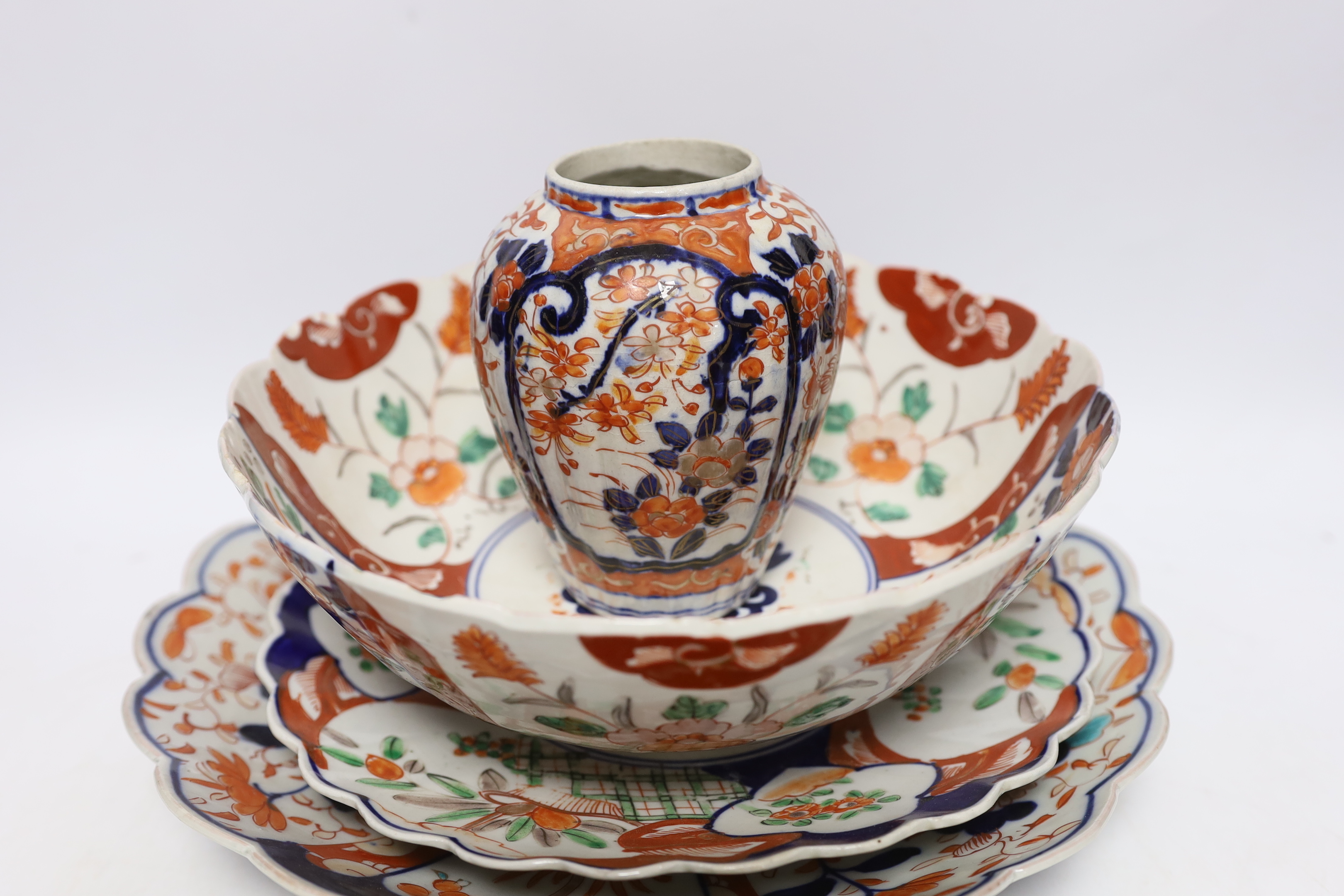 A group of Japanese Imari plates, dishes, a bowl and a vase